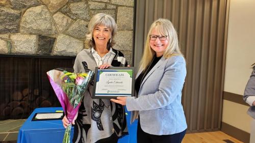 Lynda Edmonds presented with the Service Award certificate for completion of 10 years of service at Fraserside by Board Director Kathryn Petersen