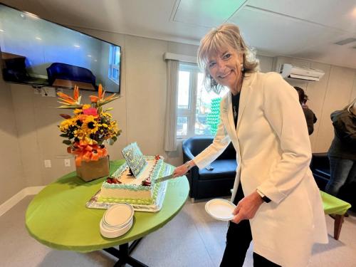 CEO Lynda Edmonds cut the cake that was specially prepared for the 50th Anniversary celebration.