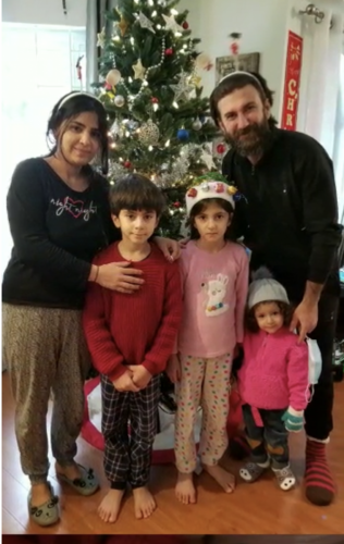 A family at the Emergency Shelter enjoying the holiday season together